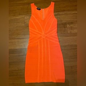 Bebe XS /S bright orange going out dress. Fitted/stretchy Very comfortable